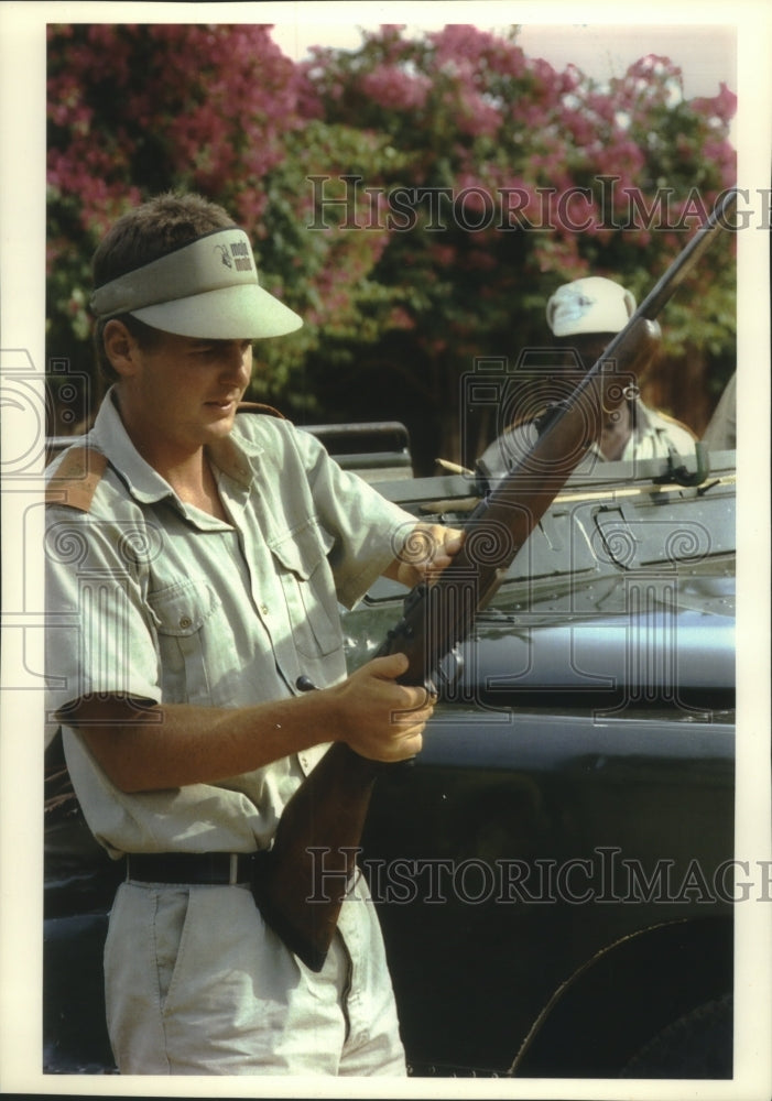 1993 Press Photo Man inspected gun in South Africa - mjc16851 - Historic Images