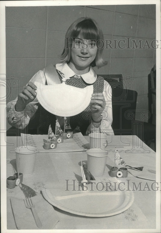 1967 Jeanne Schick, Wisconsin's Junior Miss, holds place setting - Historic Images