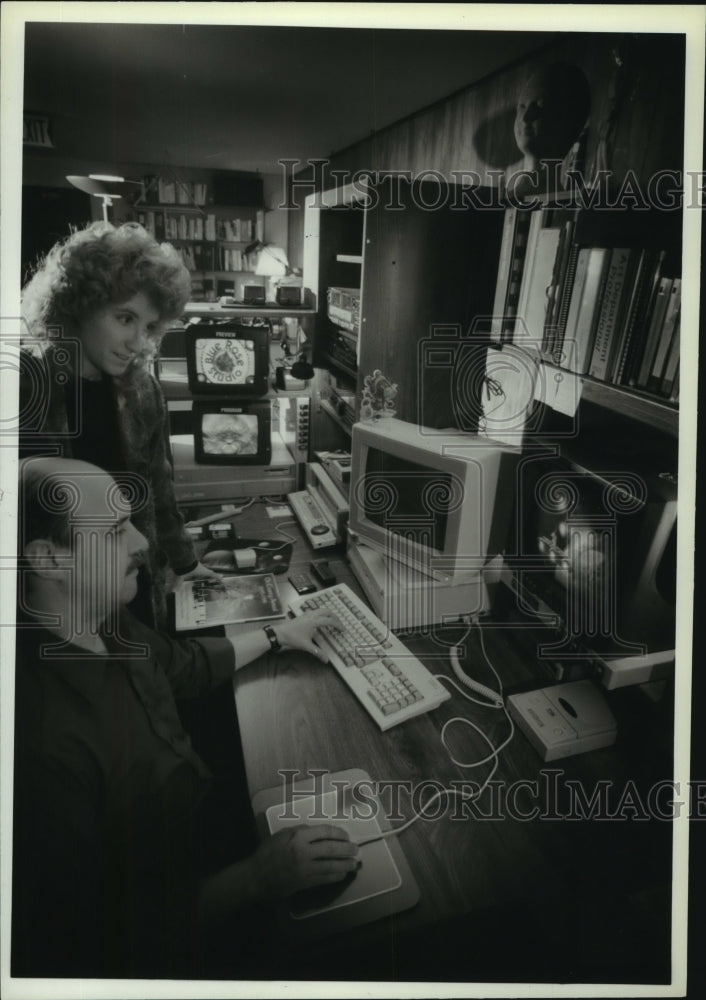 1995, Tony and Laurel Kashinn work at Blue Rose Studio in Stonecroft - Historic Images