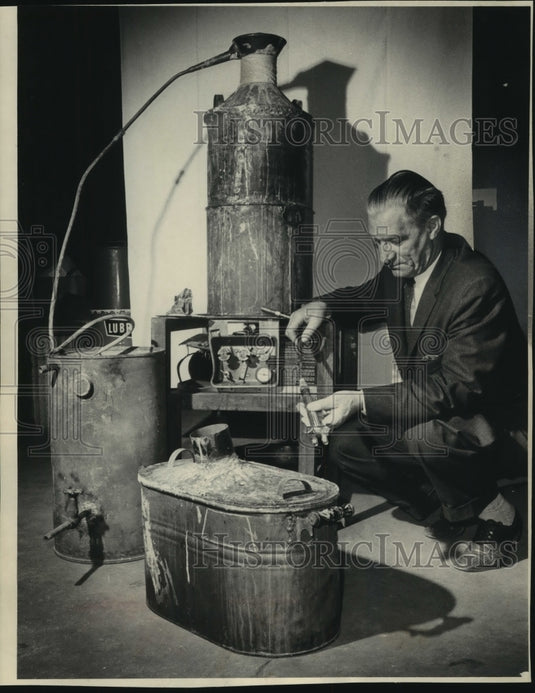 1968 West Allis Detective Herbert Holmquist examined the still - Historic Images