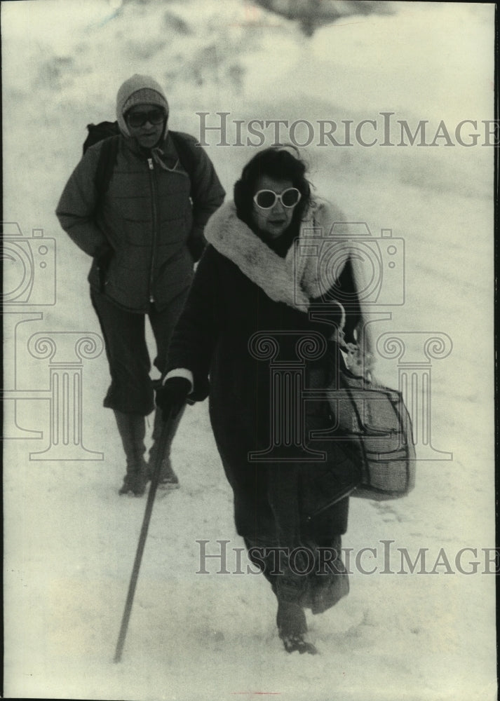 1979, Man and woman make their way through snow on Wisconsin Ave - Historic Images