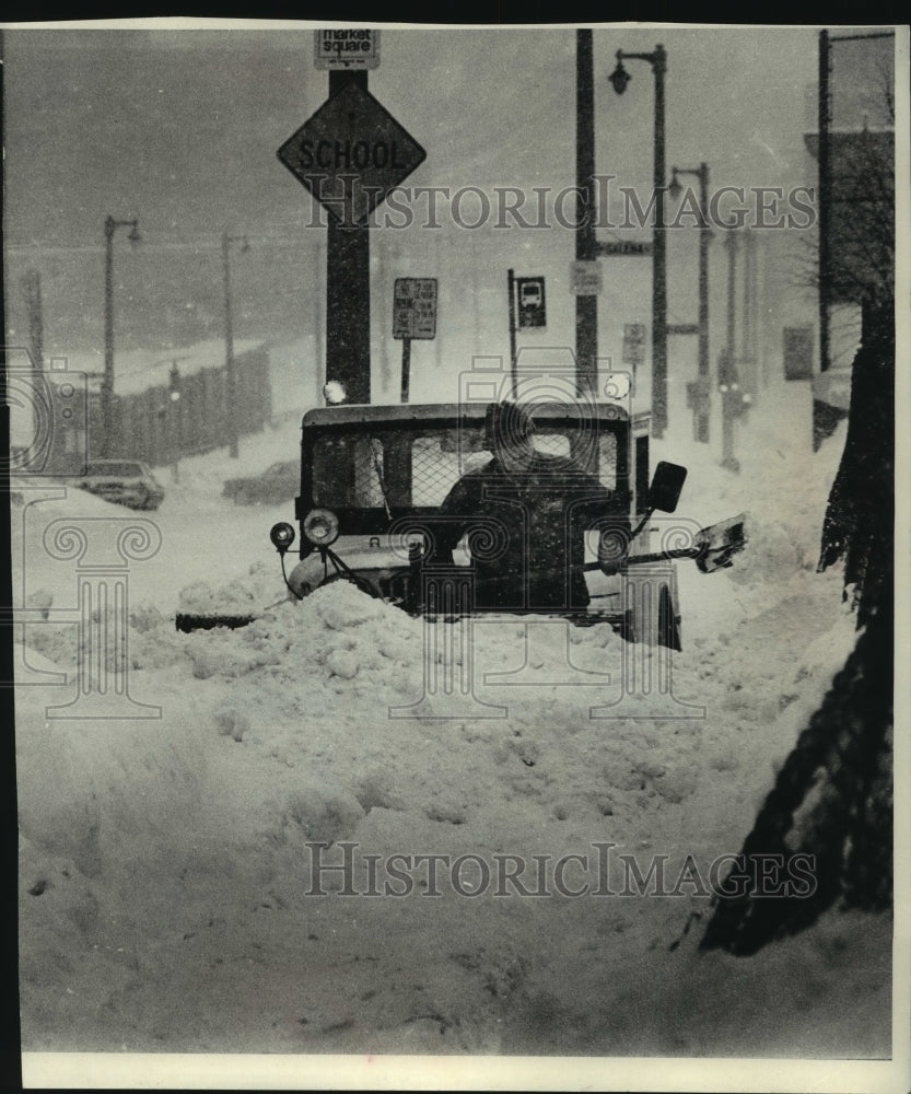 1979 Bill Schnick digs out snowplow north of Galena - Historic Images