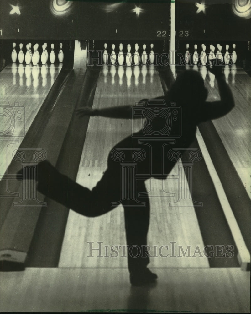 1982 A bowler sends a ball toward the pins - Historic Images