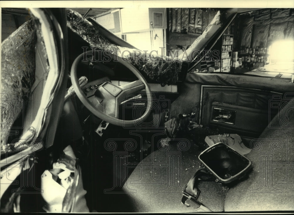 1987, Police Officer John J. Stoll's patrol car was severely damaged. - Historic Images