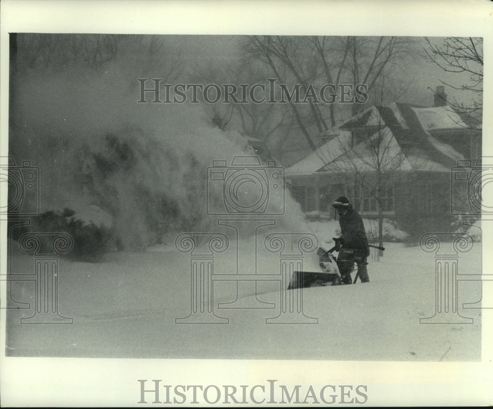 1978 Daniel (Duffy) Gruver snow blowing sidewalk in Wauwatosa, WI - Historic Images