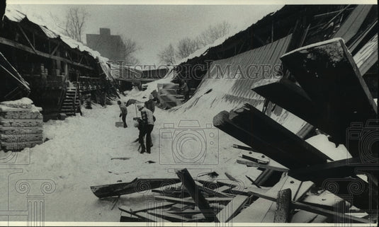 1979 Snow on metal roof collapsed at Palmetier & Abell Lumber Co - Historic Images