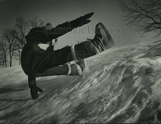 1979, A child fell down snowy hill while playing in Menomonee Falls - Historic Images