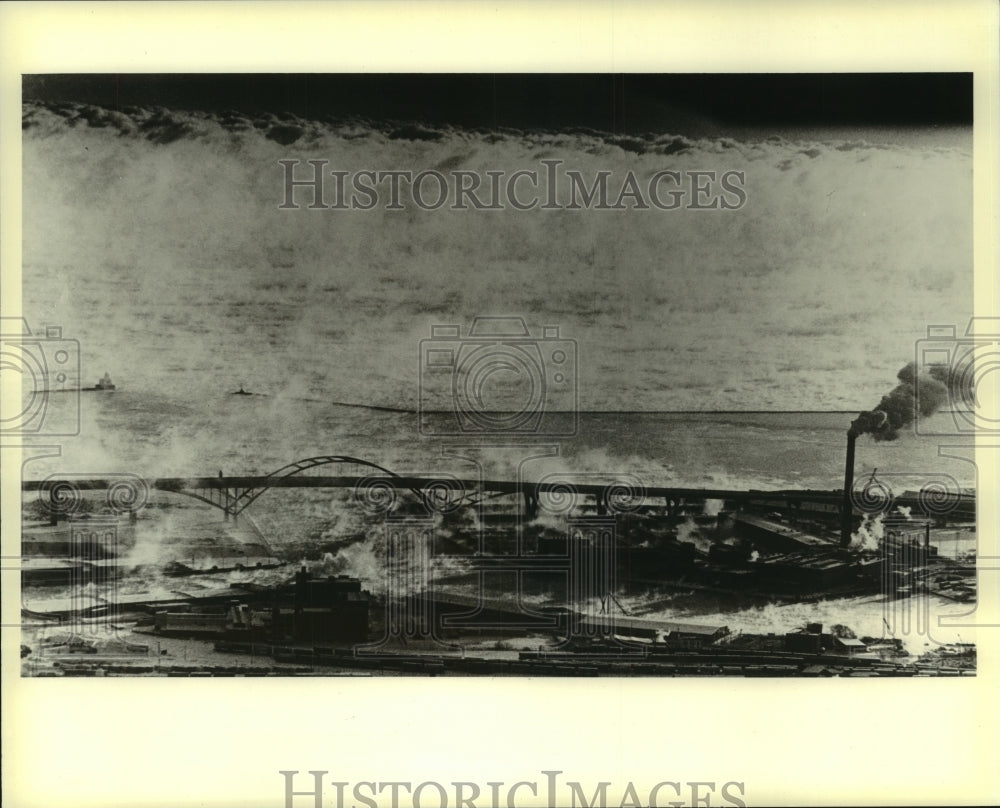 1982 Water vapor from lake formed clouds near Hoan Memorial Bridge - Historic Images