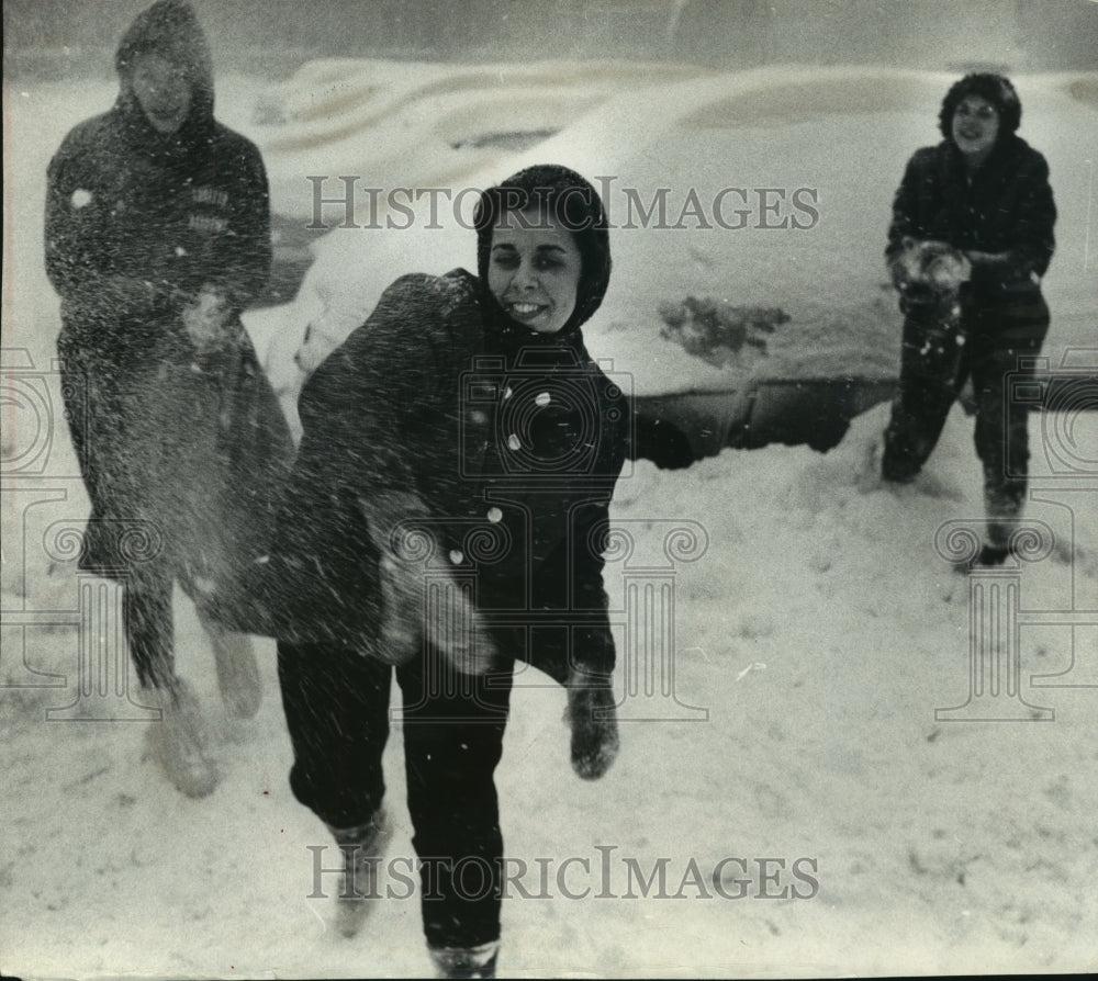 1961 Press Photo Patricia Kleczka in a Snowball fight at Marquette University-Historic Images