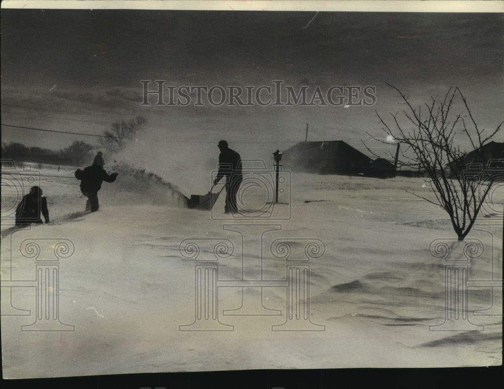 1964, John W. Deabler using a snow blower, Menomonee Falls, Wisconsin - Historic Images