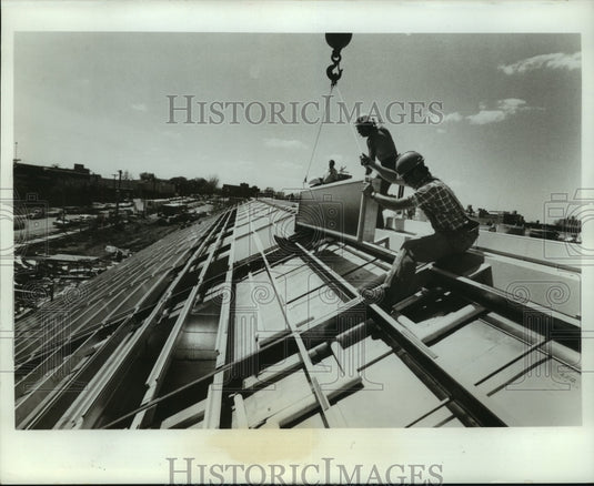 1976, Monsanto Co. solar energy collector systems being installed - Historic Images