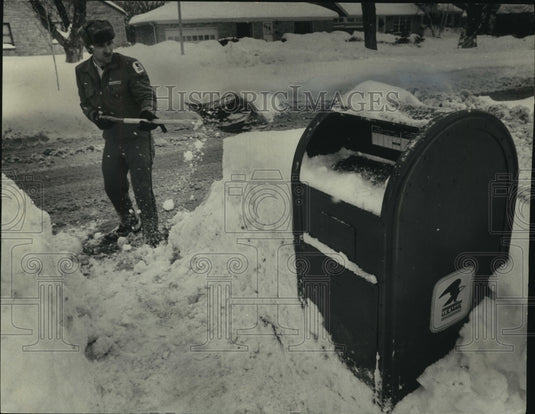 1979 Letter carrier Mark Eisold shoveling snow, Wisconsin - Historic Images