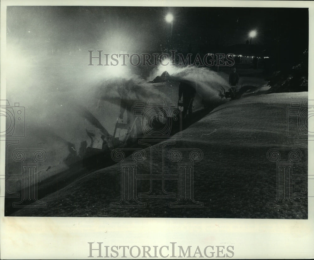 1979 Person clearing a sidewalk with snowblower, Menomonee Falls - Historic Images