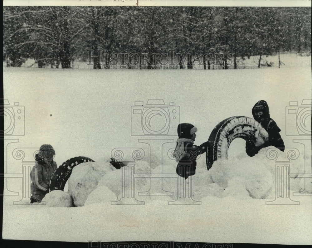 1979, Pacific Elementary School pupils playing in snow, Wisconsin - Historic Images