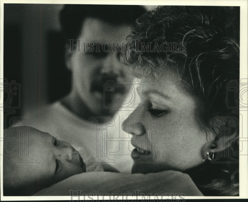 1990, Randall and Lori Kau holds son Garrett at home in Waukesha - Historic Images