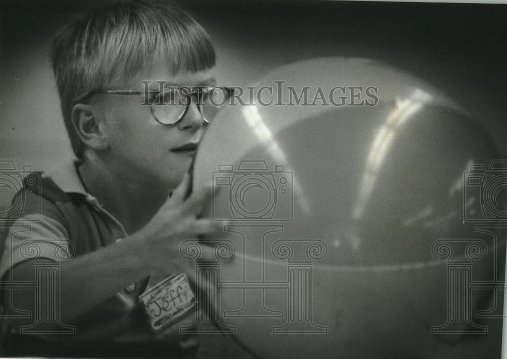 1993, Jeff Duestow, playing table ball at Trinity Church Care Center. - Historic Images