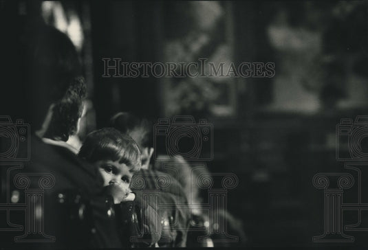 1992 Jeffrey Welgand of West Bend listens at Trinity Lutheran Church - Historic Images