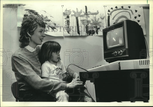 1982 Teacher Janaye Houghton with Leia Tagtow in Dousman classroom - Historic Images