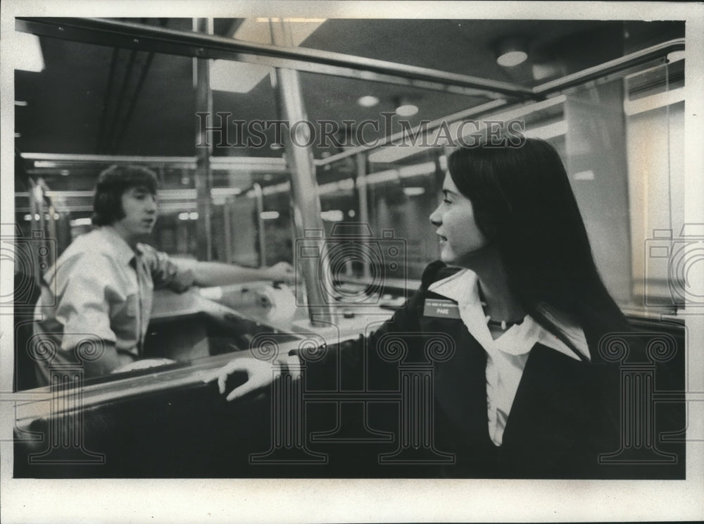 1975 Karin Tills taking subway between buildings - Historic Images