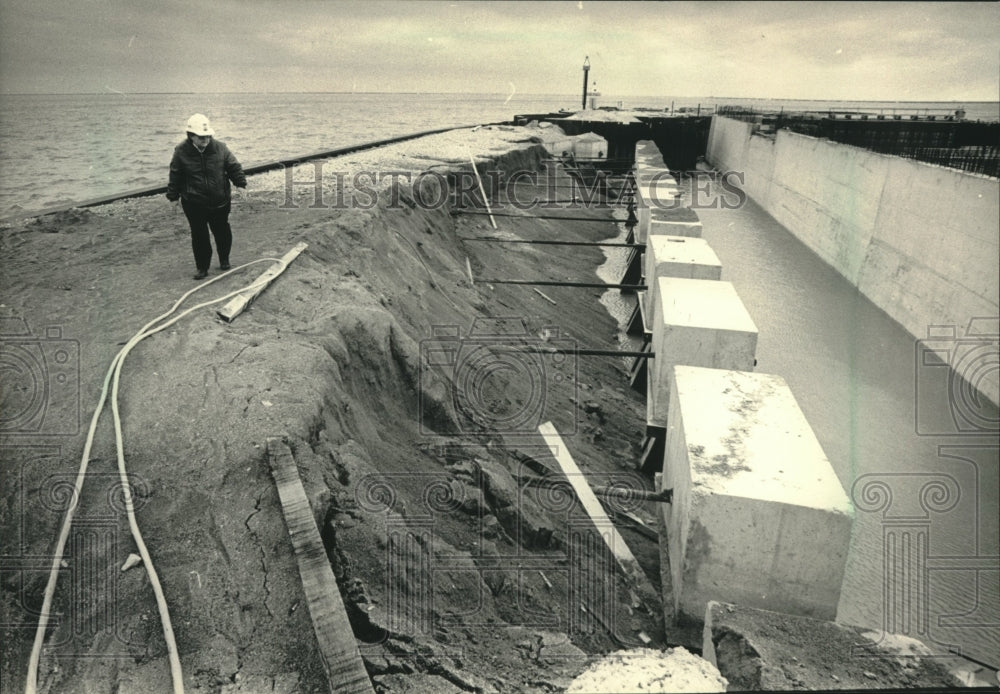 1986, Judy Grzegorski inspecting landfill on E. side of Jones Island - Historic Images