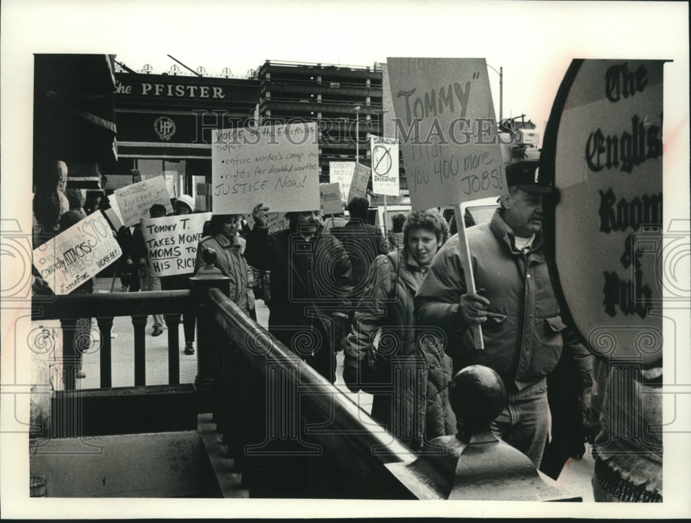 1989, Pickets Protest Governor Tommy Thompson's Policies in Milwaukee - Historic Images