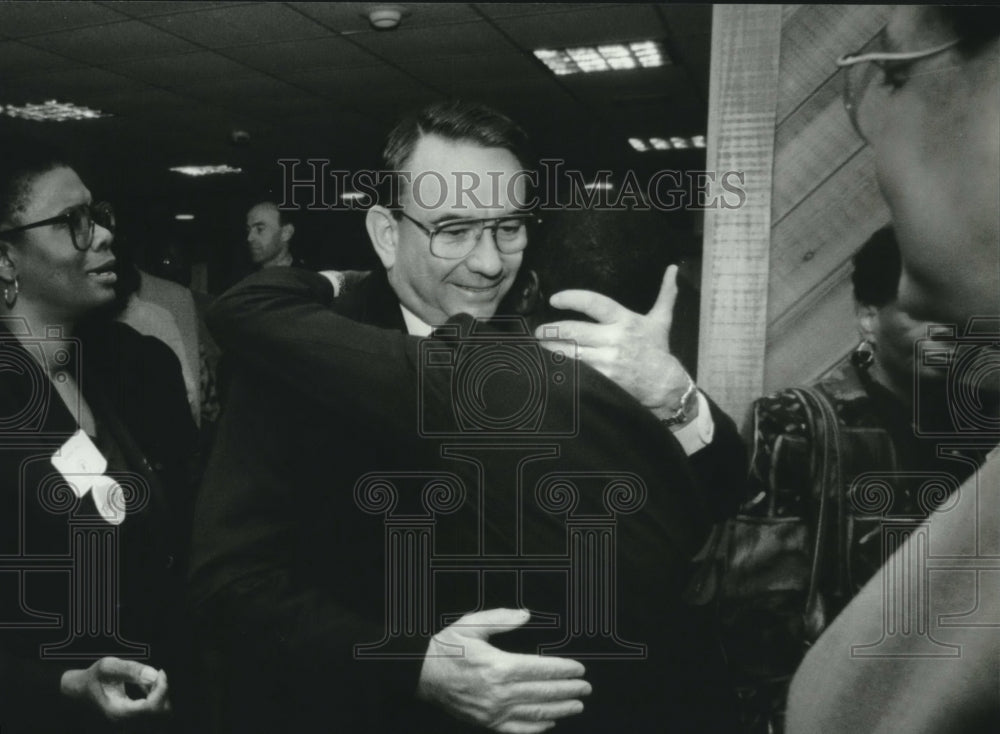 1994, Tommy Thompson hugging someone while campaigning - mjc19093 - Historic Images