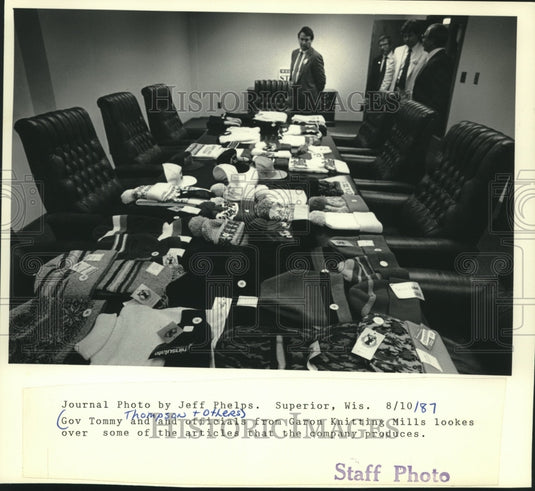 1987 Governor Thompson & others look at Garon Knitting Mills product - Historic Images