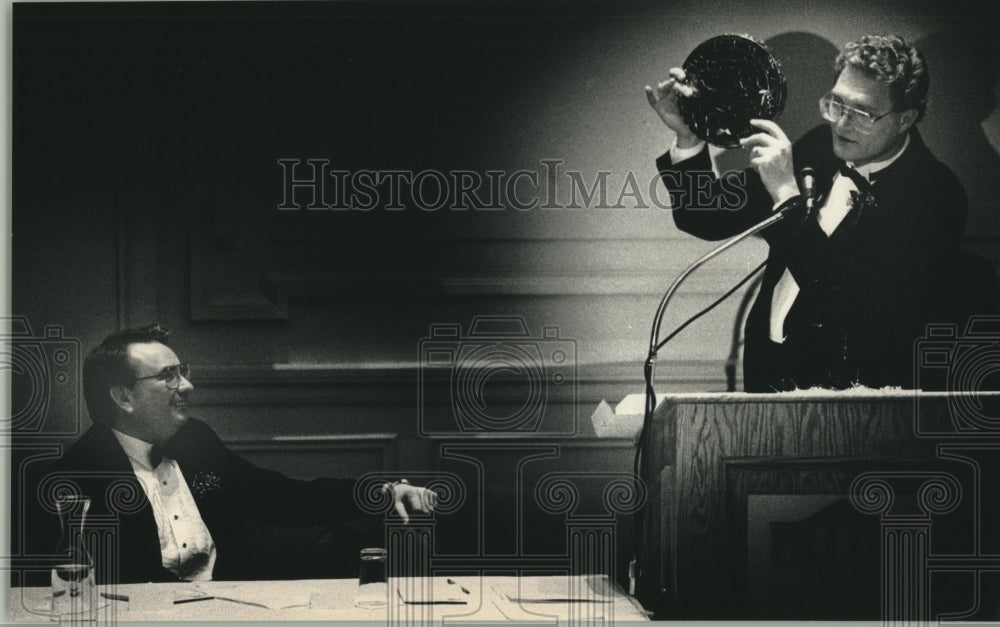 1989, Milwaukee Mayor John Norquist presents seal to Gov. Thompson - Historic Images