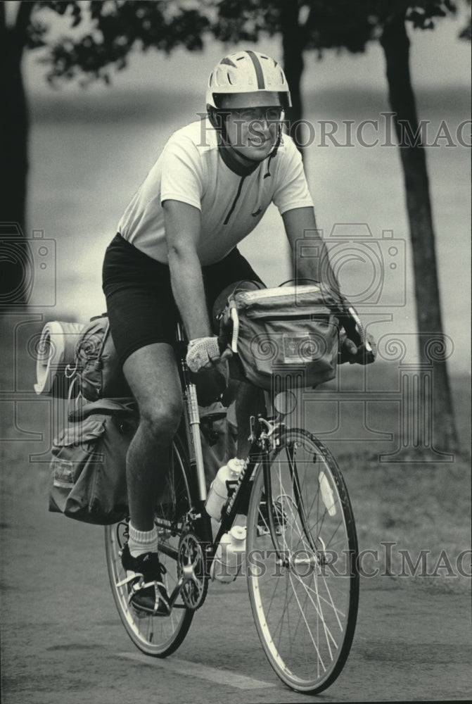 1985 Peter Tropman, cross-country biking by Lake Monona, Madison. - Historic Images