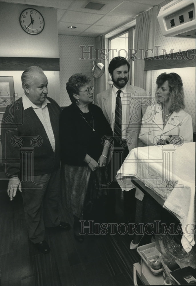 1988 Richard, Vernon and Pat Gerasch With Lauri Frank at Hospital - Historic Images