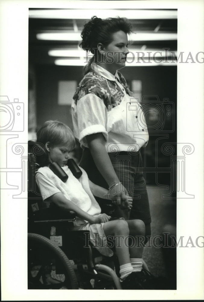 1993, Trisha Repinski and David Olsen Watch Game at Trinity Memorial - Historic Images