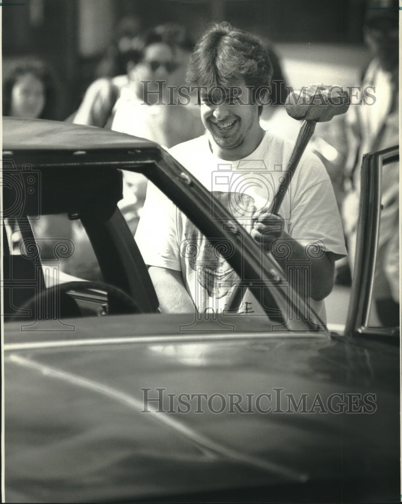 1993 Student with sledgehammer, fundraiser, University of Wisconsin - Historic Images