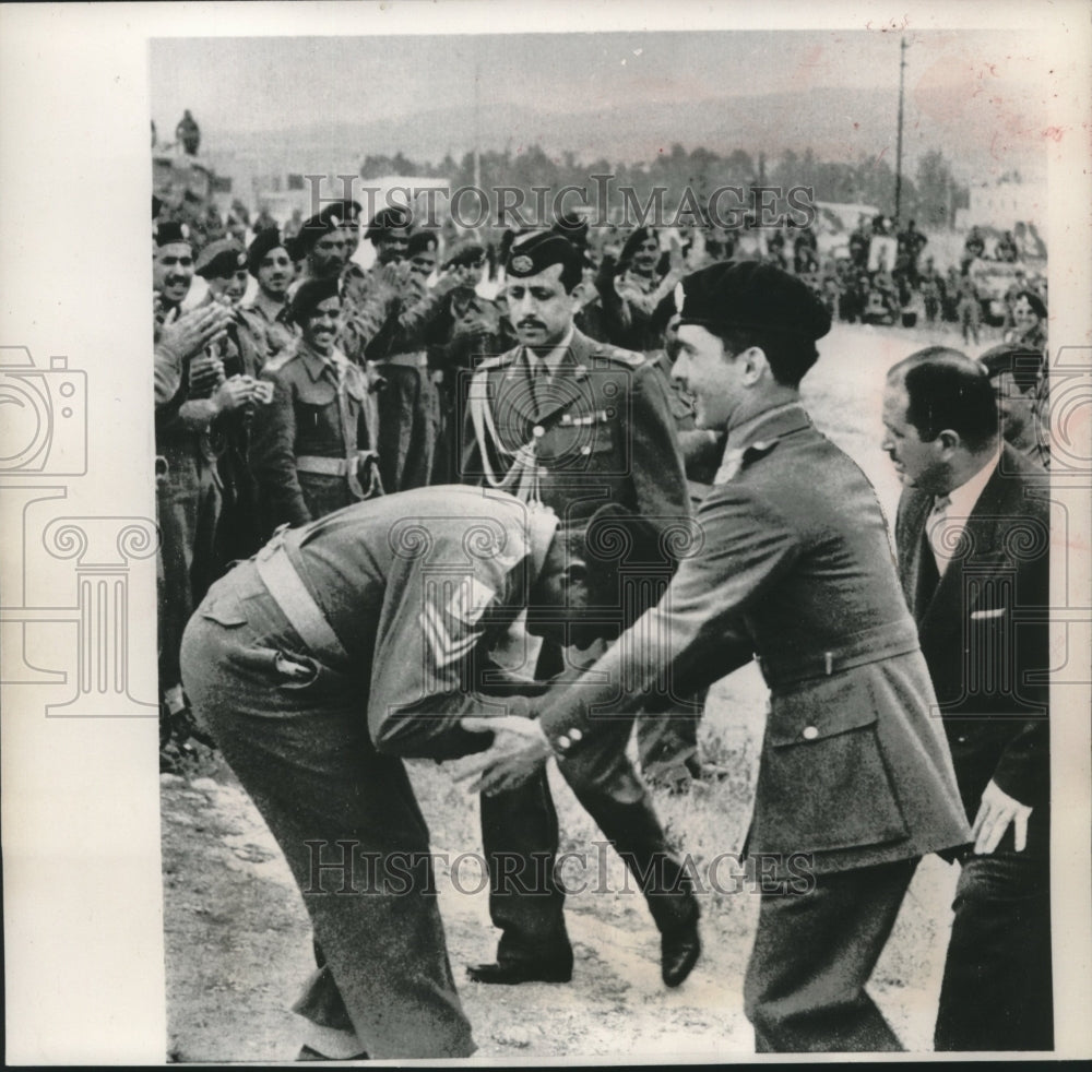 1957 Press Photo Loyal Soldier Kisses King Hussein of Jordan's Hand - mjc19528 - Historic Images