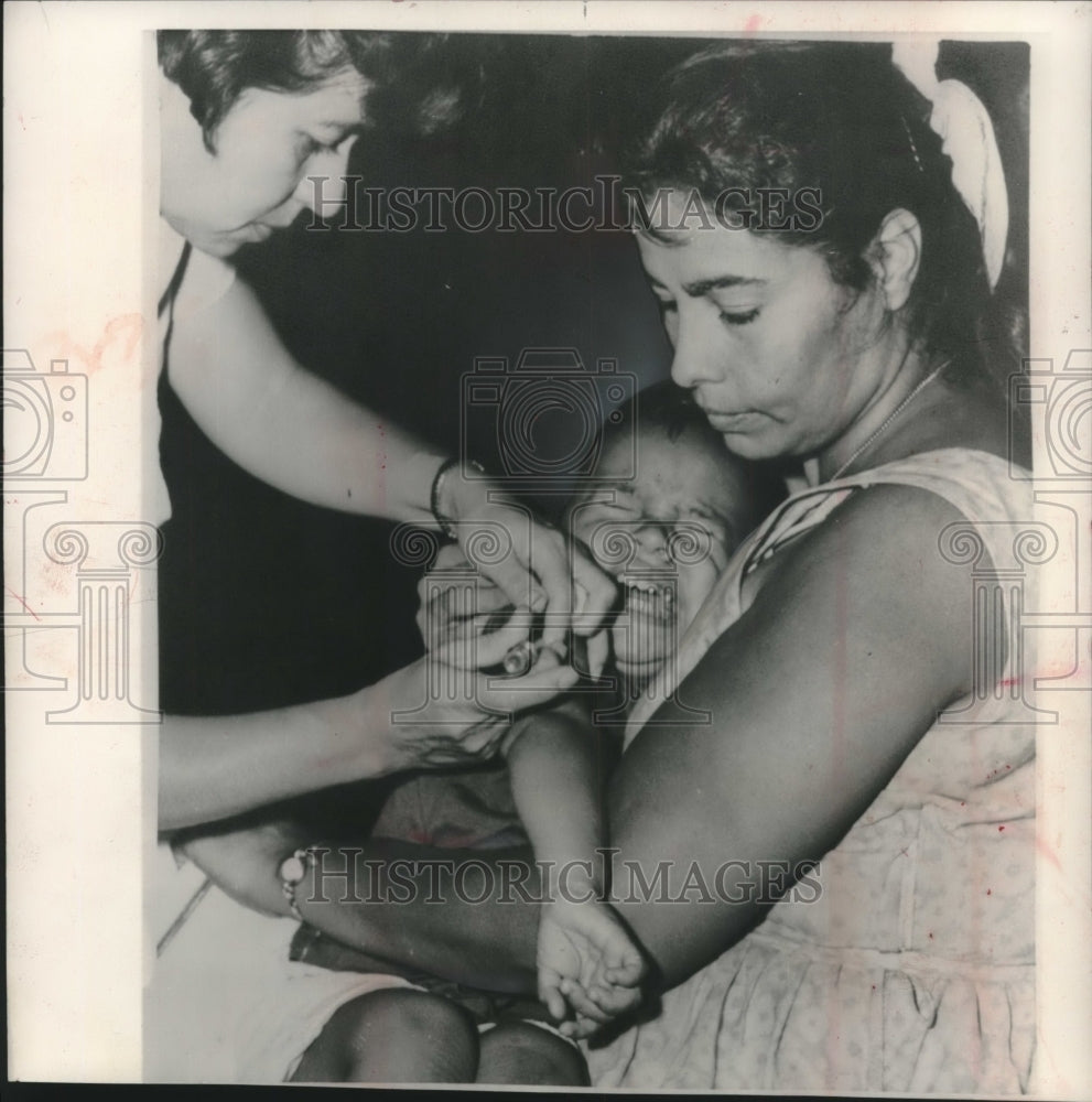 1961, Frank Langoria Cries as Nurse Gives Him a Shot in Houston - Historic Images