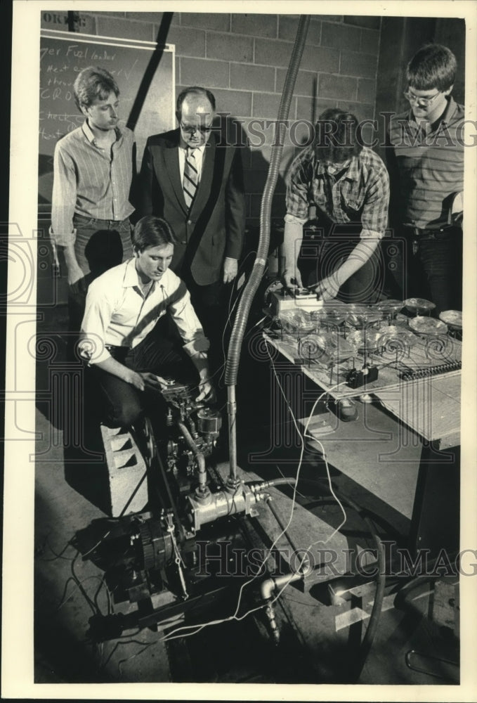 1987, Prof. Pavelic, students checking project at UWM, Wisconsin. - Historic Images