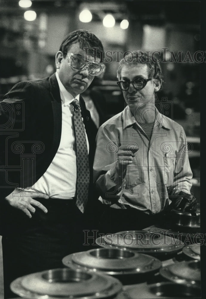 1990, Tommy Thompson Listens to Harry Olson Falk Corp. in Milwaukee - Historic Images