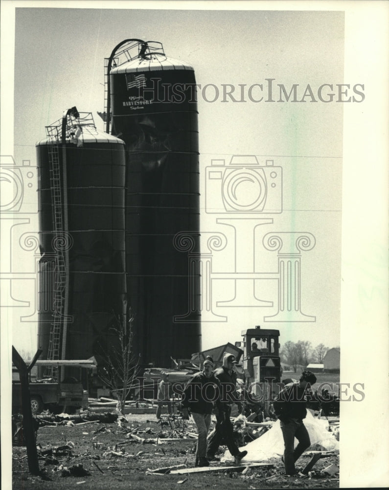 1984, Cleanup volunteers at tornado damaged Harvestores in Wisconsin - Historic Images
