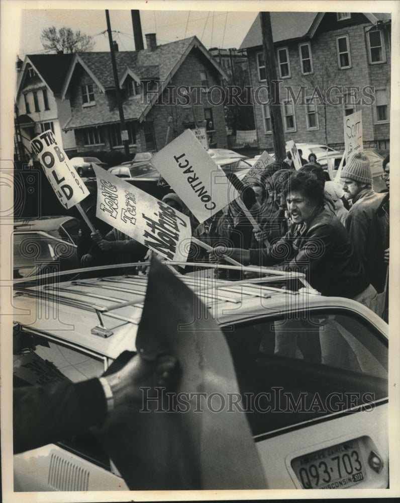 1977, Picketers scream at Nonstriking Teachers in Milwaukee - Historic Images