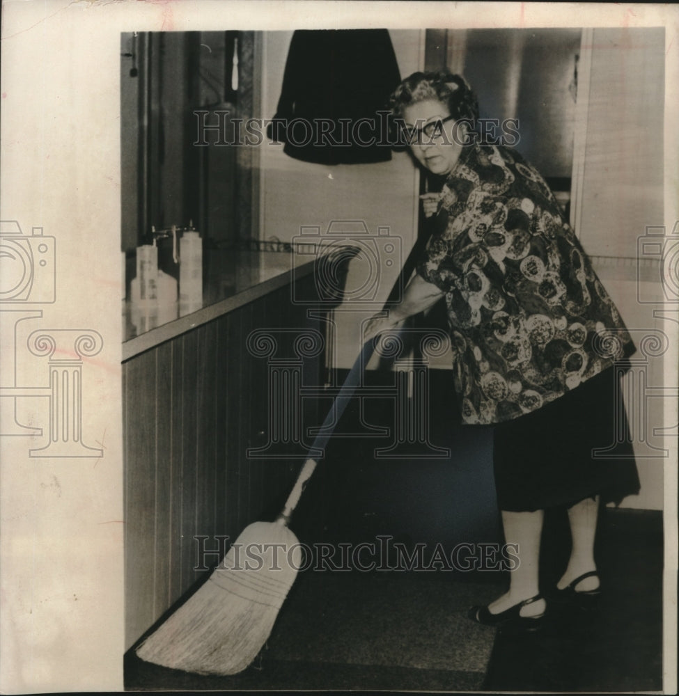 1963, Mrs. Mildred Valachi sweeping - mjc19948 - Historic Images