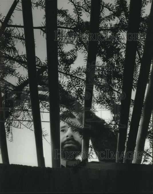 1993 Nathaniel Hoffman builts a sukkah at home for Jewish holiday - Historic Images