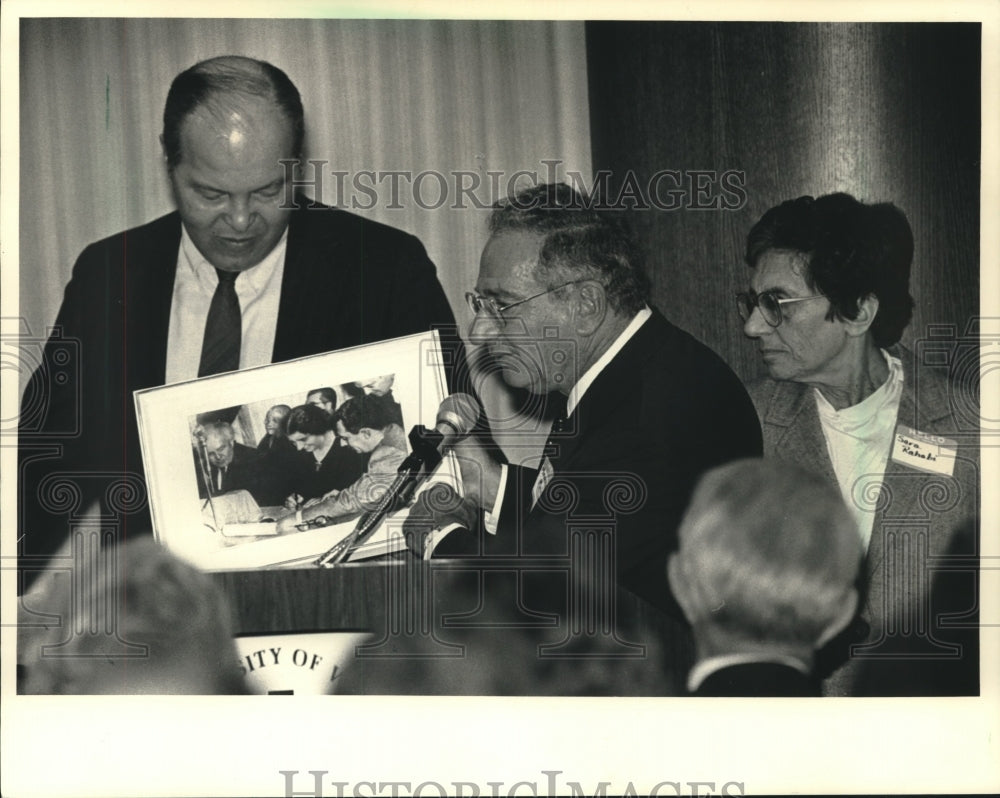 1987, Menahem Meir and Sara Rahabi present photo of Golda Meir to UWM - Historic Images