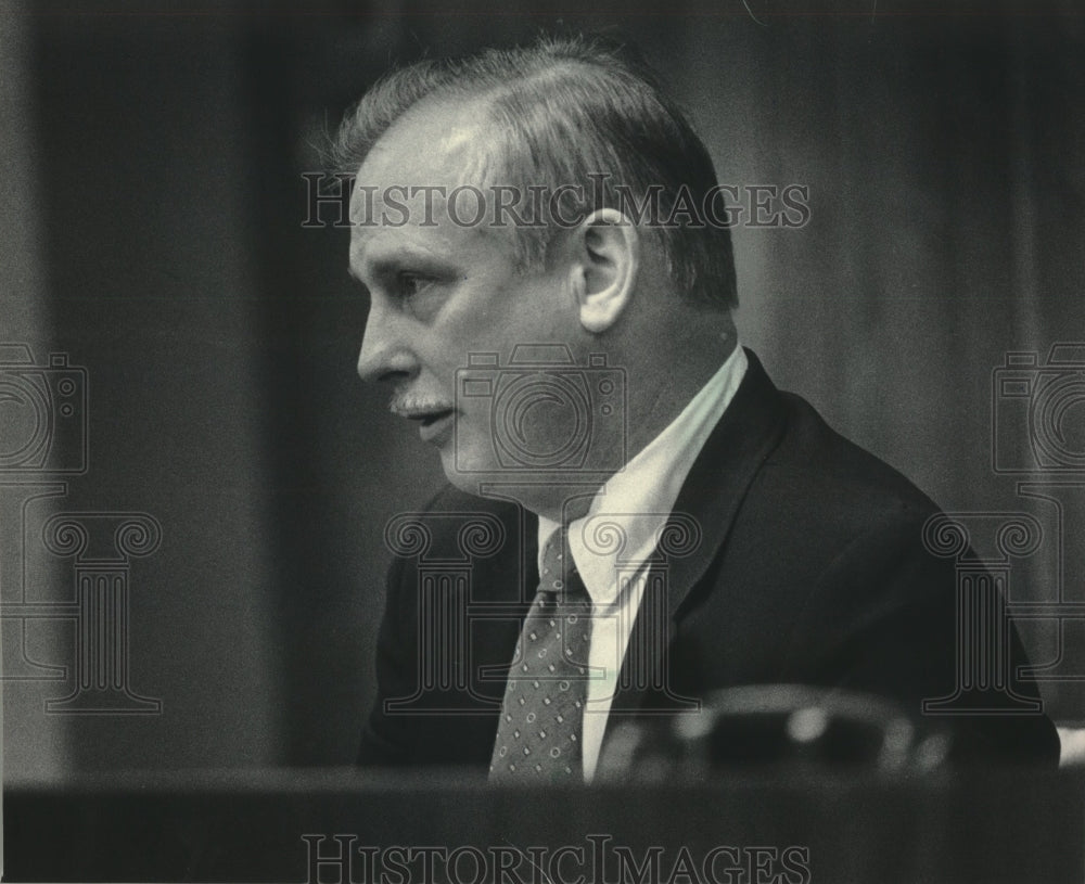 1986, Charles Treadwell city clerk at dismissal hearing, Mequon. - Historic Images