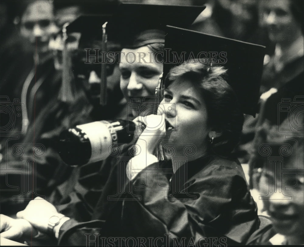 1986 Laura Schmidt, Kelly Harder celebrate graduation, Wisconsin. - Historic Images