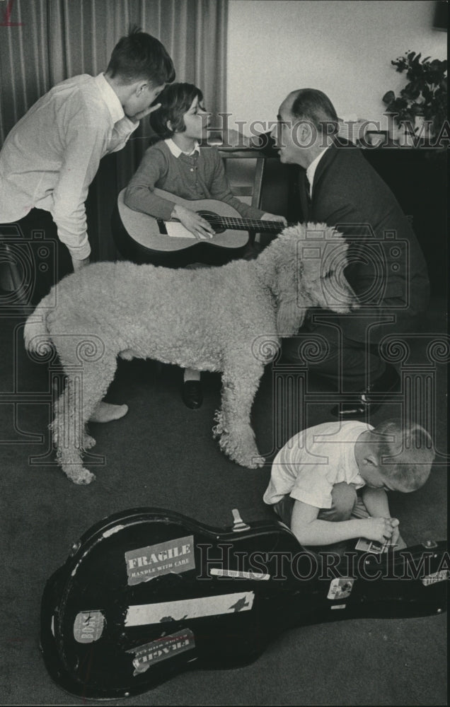 1965, Gaylord Nelson listens to his children sing - mjc20332 - Historic Images