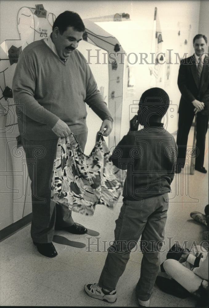 1989, County Executive David Schulz shows his jam shorts, Wisconsin - Historic Images