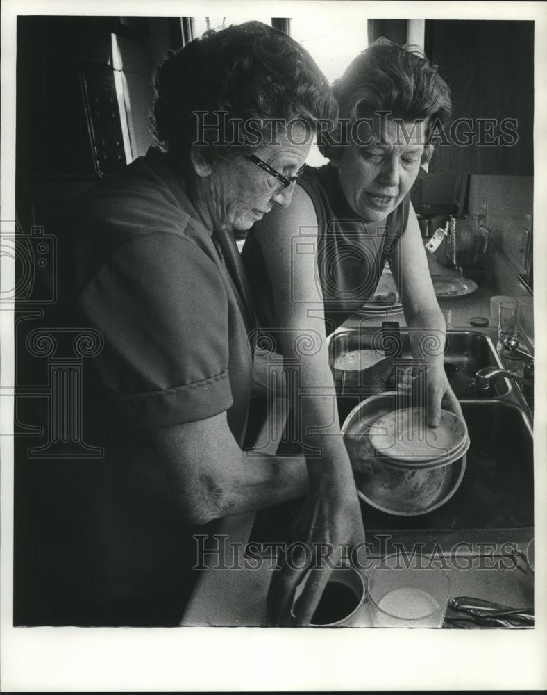 1976, Petu Senn and Family work in home kitchen, Wisconsin - Historic Images