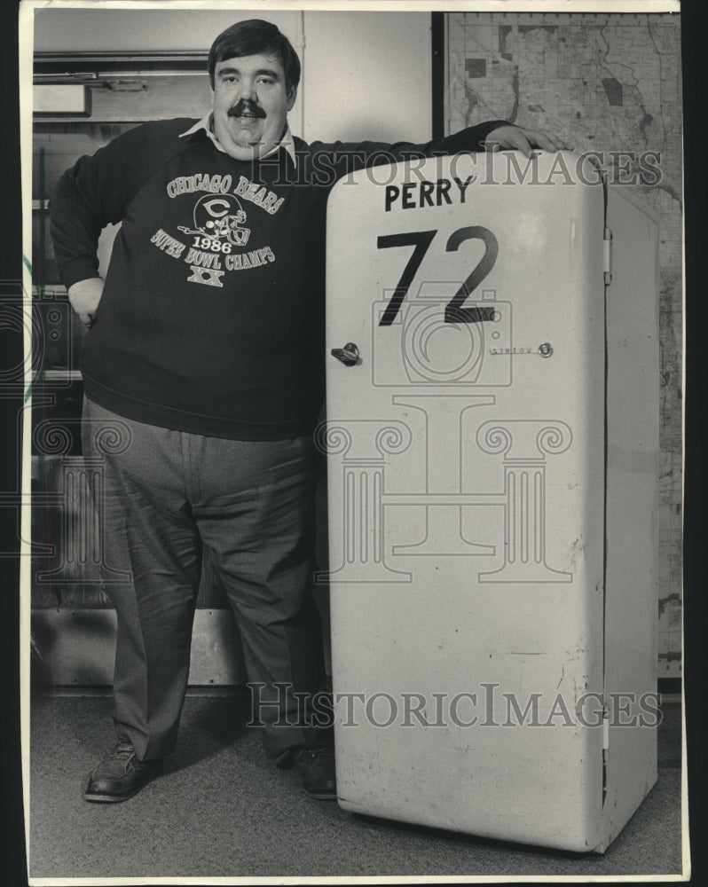1986, County parks director, David, F. Schulz next to refrigerator - Historic Images