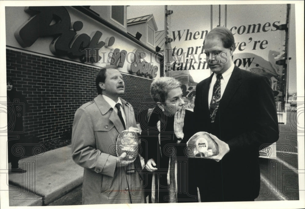 1992, Executives in front of Pick &#39;n save, Hormel gifts, hams, turkey - Historic Images