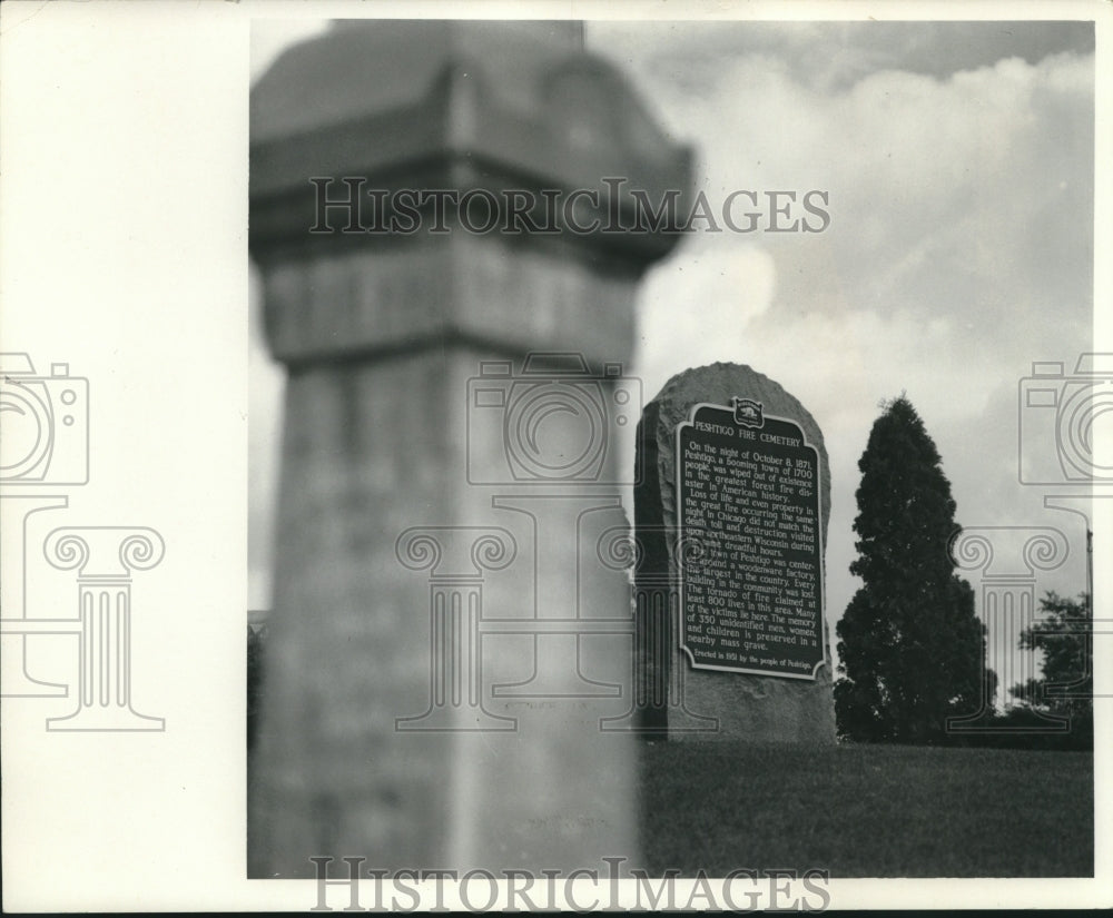 1968, A plaque tells history of the Peshtigo Fire Cemetery, Wisconsin - Historic Images