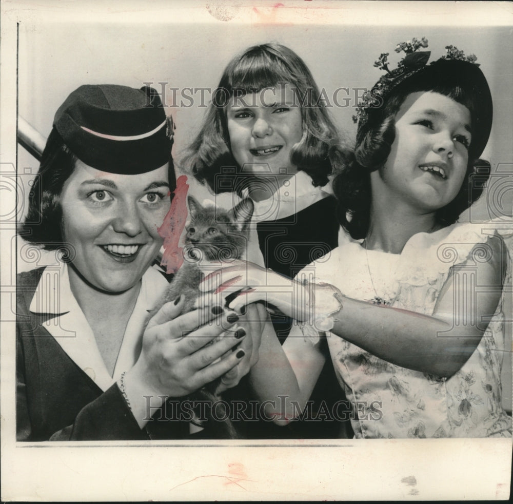 1957, Julie &amp; Patricia Nixon give kitten to a stewardess, Washington - Historic Images